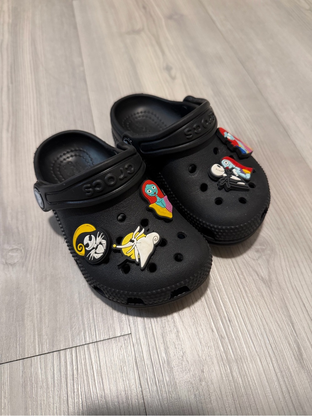 CROCS Kids Black Clogs with Colorful Character Jibbitz